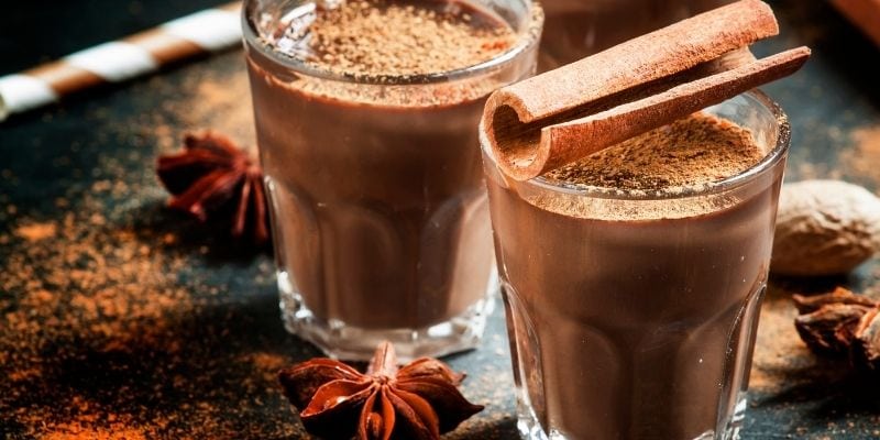 Two glasses of hot chocolate with cinnamon sprinkles  photo