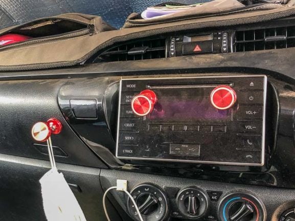 Red magnet mounts on dashboard for iphone 