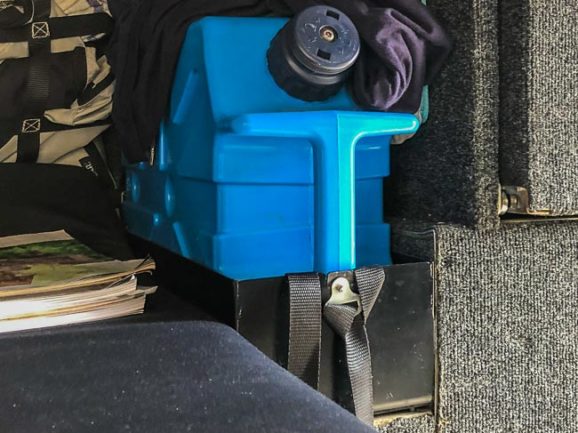 water filter container fixed into place in the bush camper