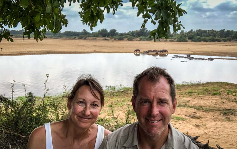 Lars and Shelley at crooks corner with river of hippos in the background