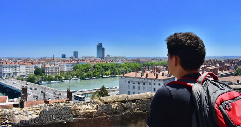 Nomadic Matt in Europe - looking out over river and rooftops