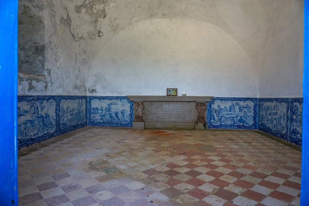 inside of a chapel with blue tiles