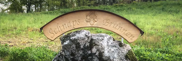 schnapps Brunnen sign in Sasbachwalden