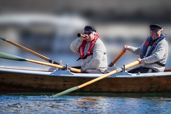 couple rowing and cheering on May 17th