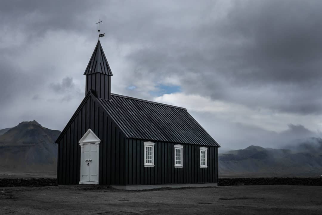 Breathtaking Icelandic landscapes_Búðakirkja black church with a dark stormy backdrop