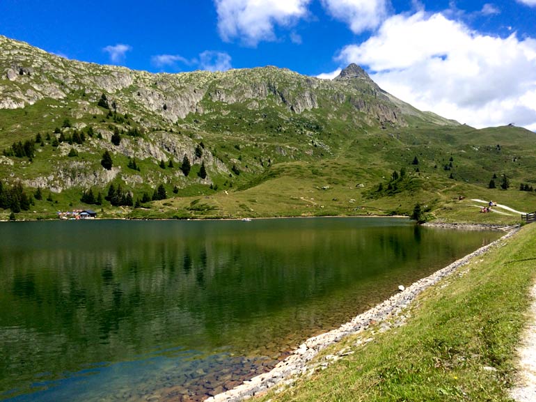 Oberalpsee Lake with mountains in the background 