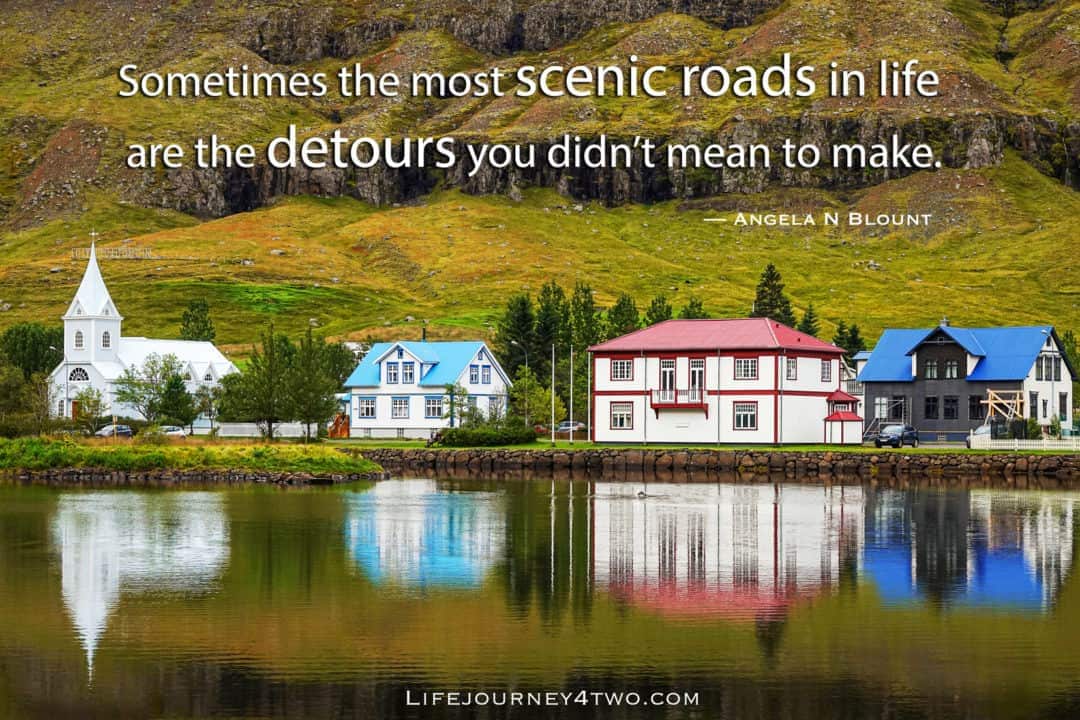 Houses on a lake with road trip quote 