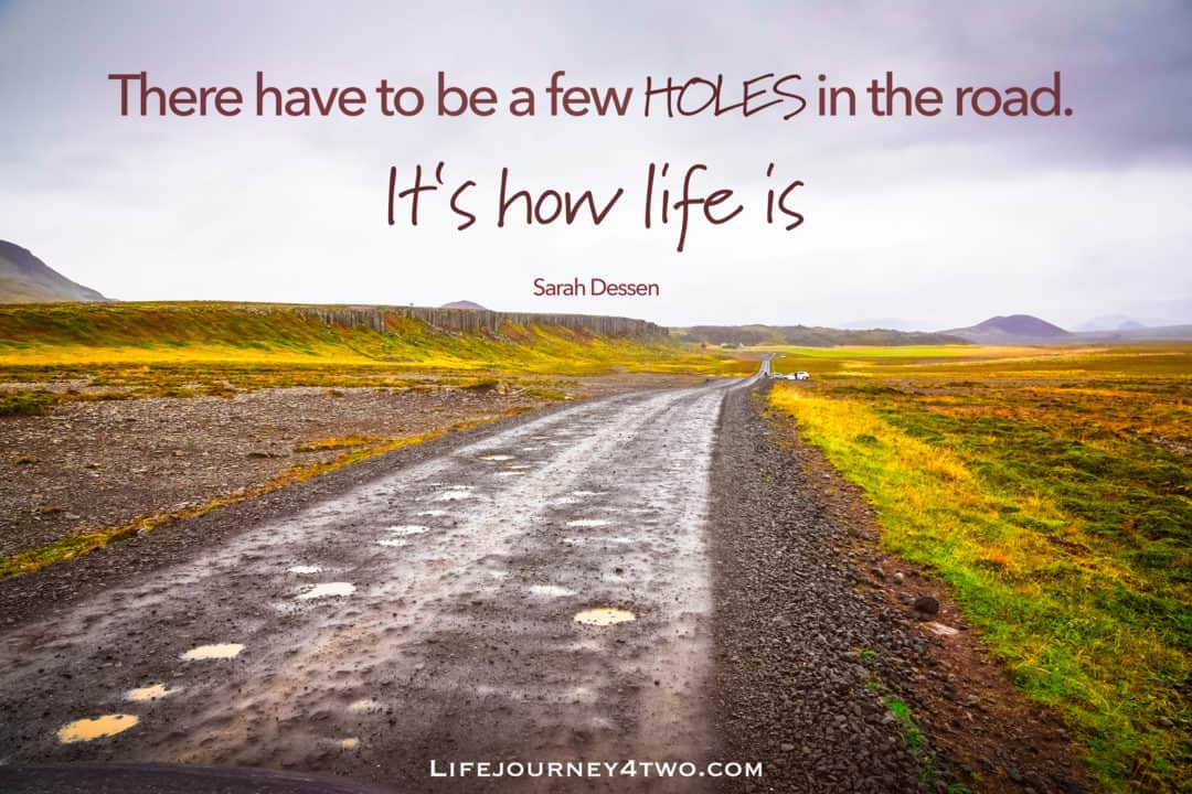 Road trip quote on image of road with lots of potholes 