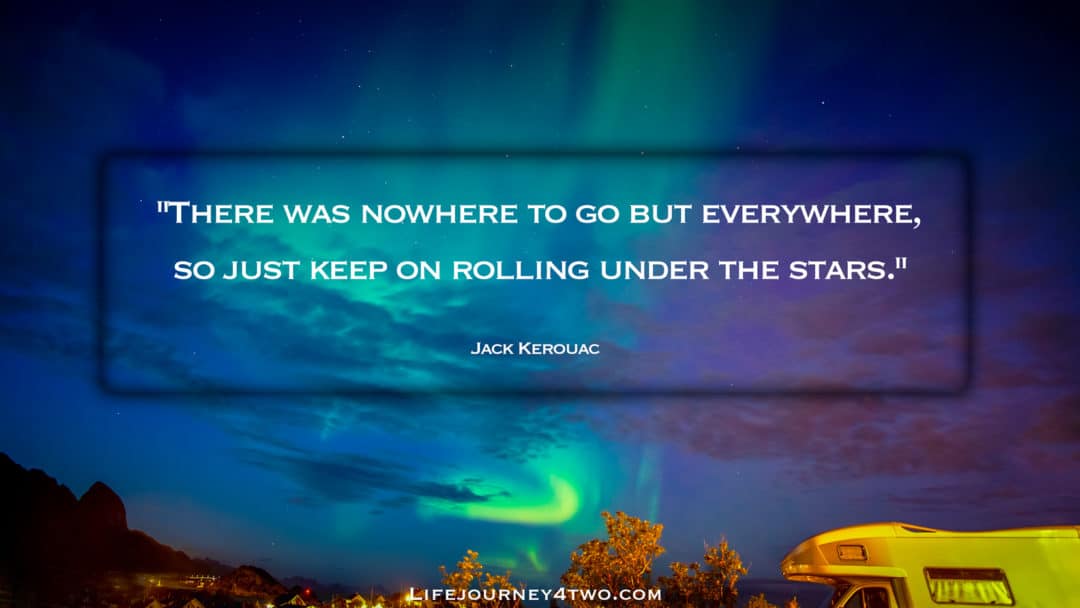 Road trip quote on photo of northern lights with a motorhome in the foreground