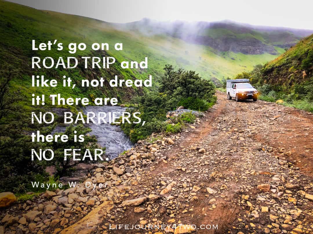 Road trip quote on image of gravvely rocky road with a 4x4 white bush camper 