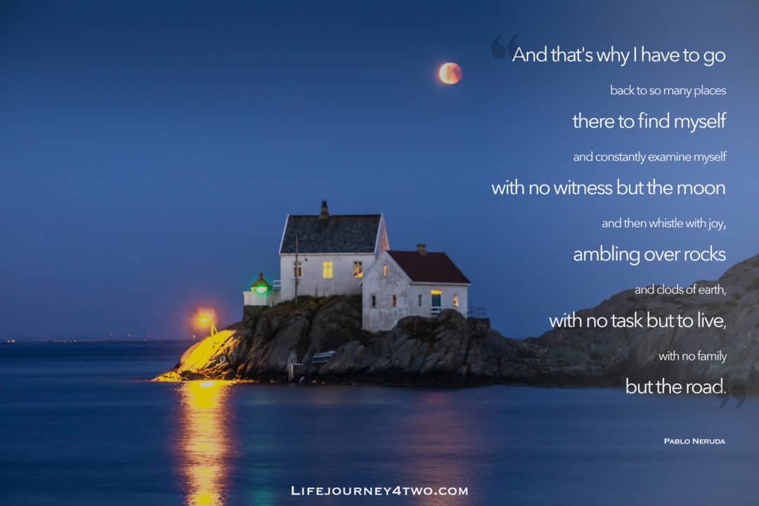 road trip quote on photo of two white buildings on a rocky peninsula in teh ocean with the moon shining above