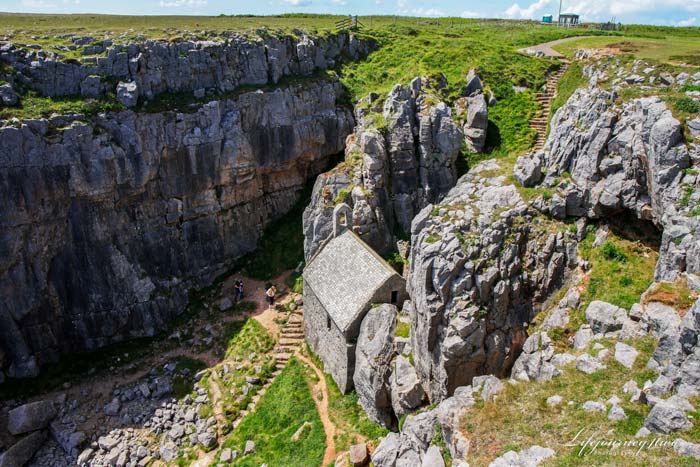 st.Govans chapel - a stone bulding between two rocks meteres from the ocean in Pembrokeshire