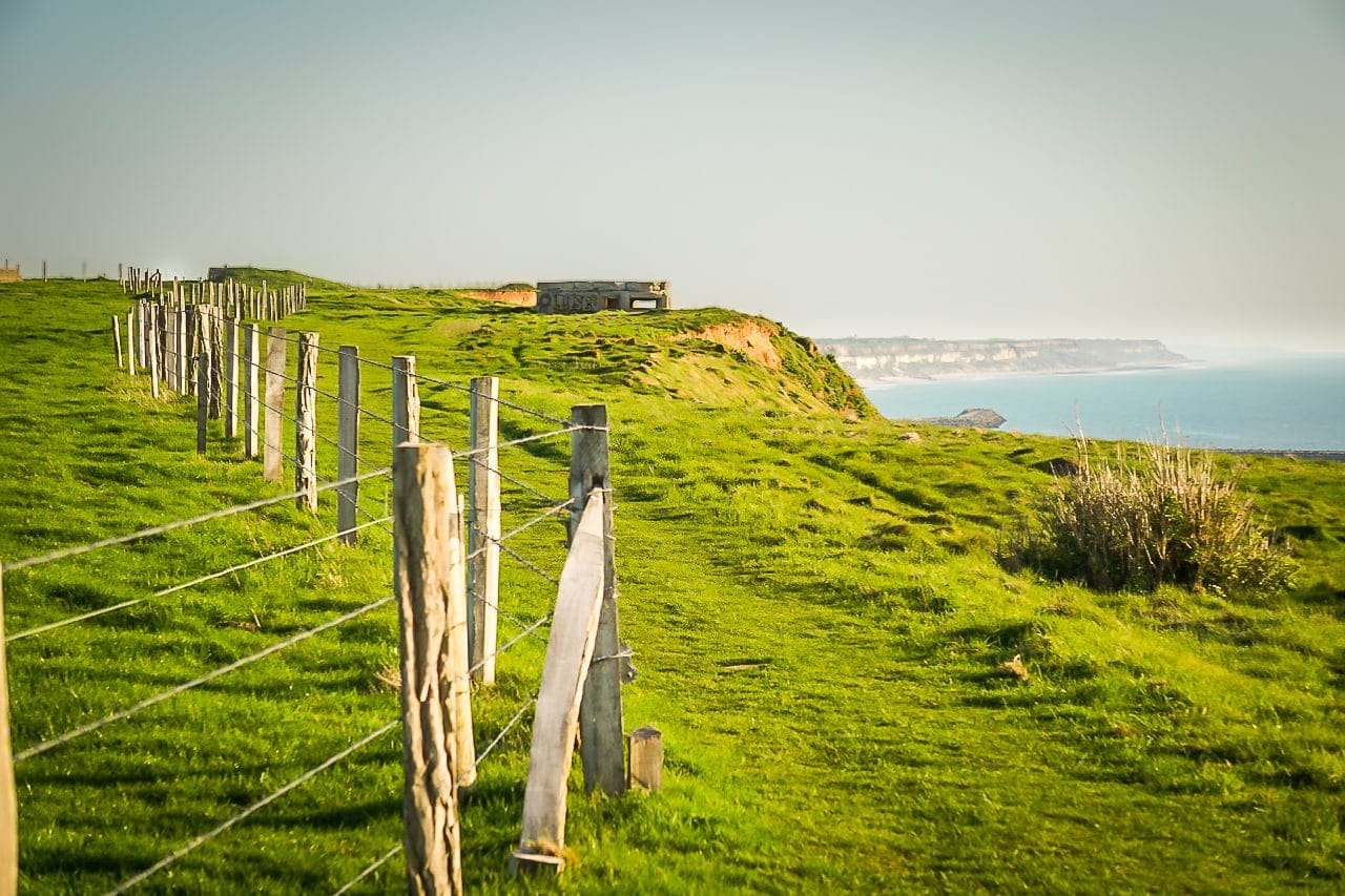 A walking path follows the steep cliffs