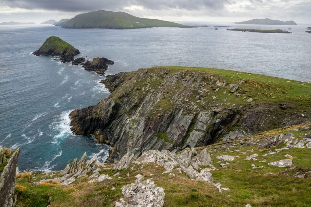 View over a rocky promontory with small rocks into the ocean