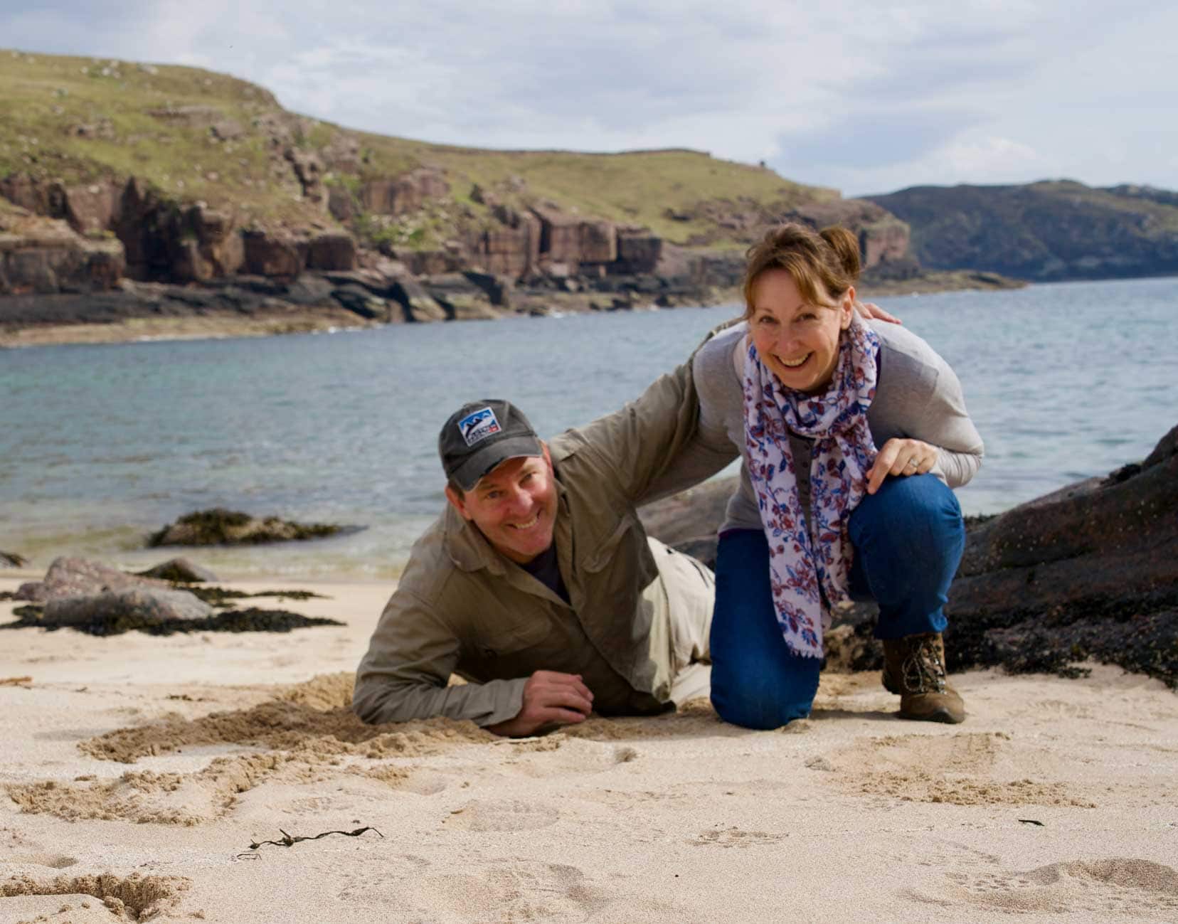 Lars-and-Shelley-on a beach in Scotland-laughing