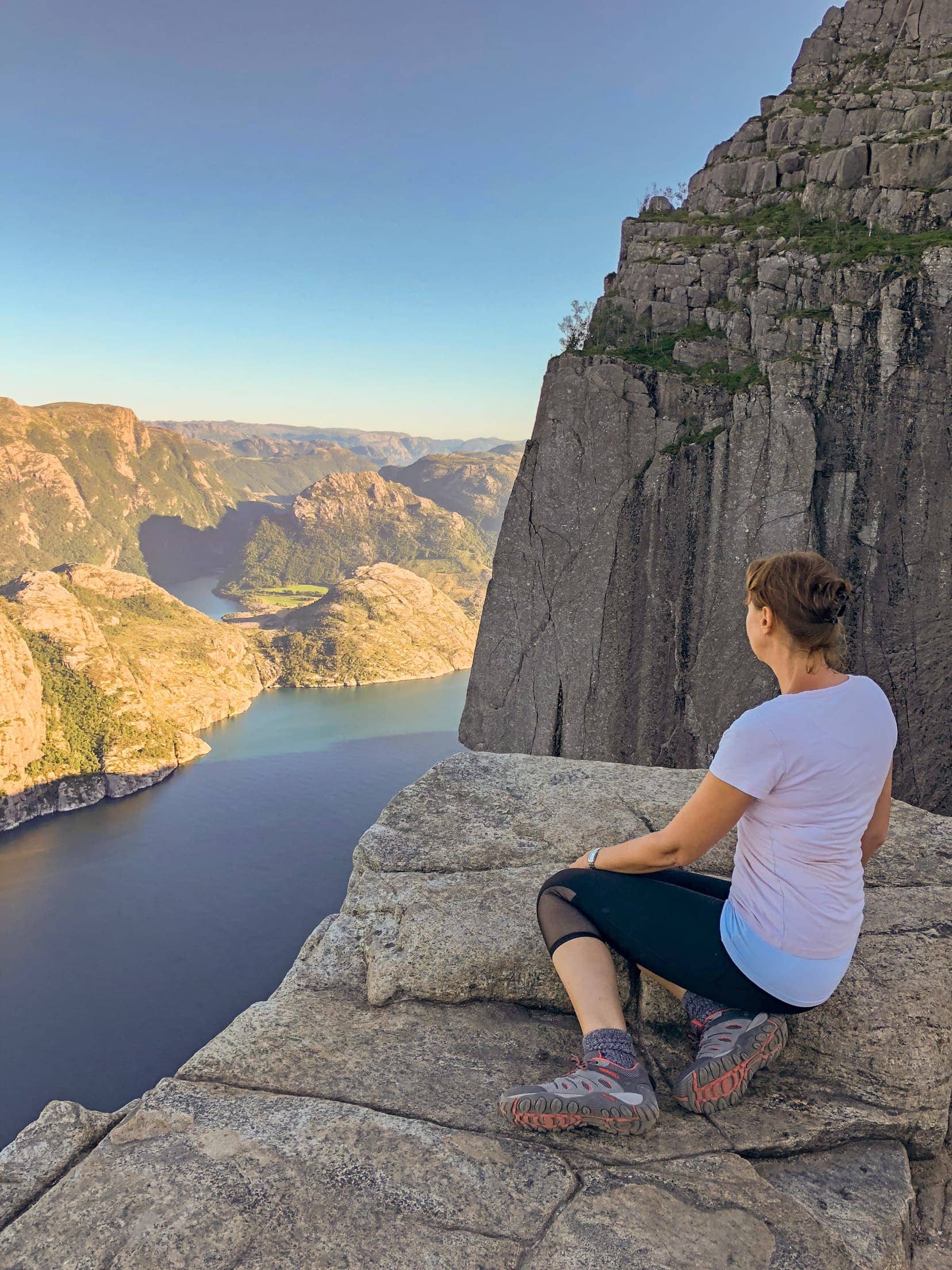 Pausing-to-take-in-the-views-from-Pulpit-Rock over a blue fjord