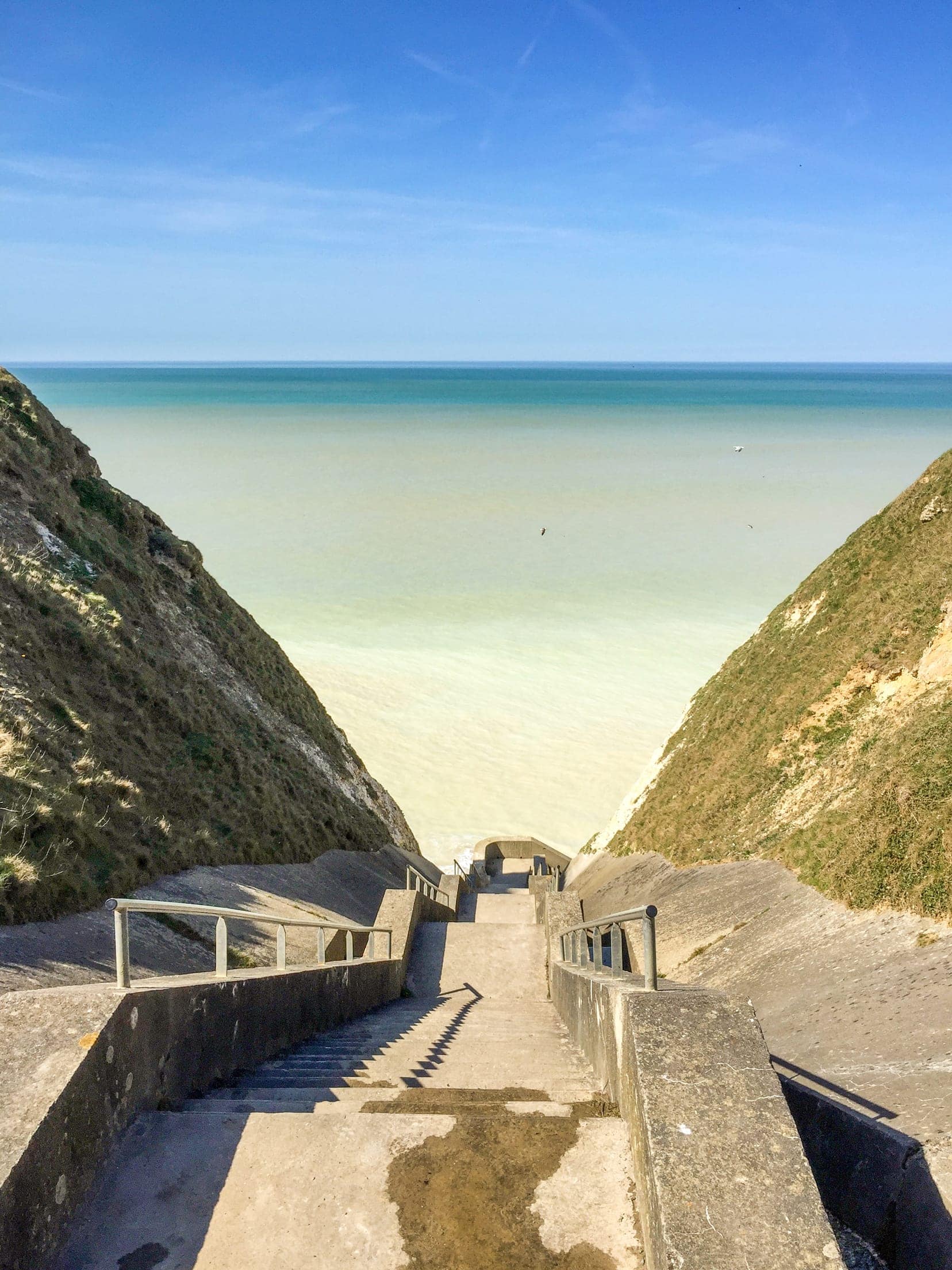 Stairway leading to the sea between the cliffs