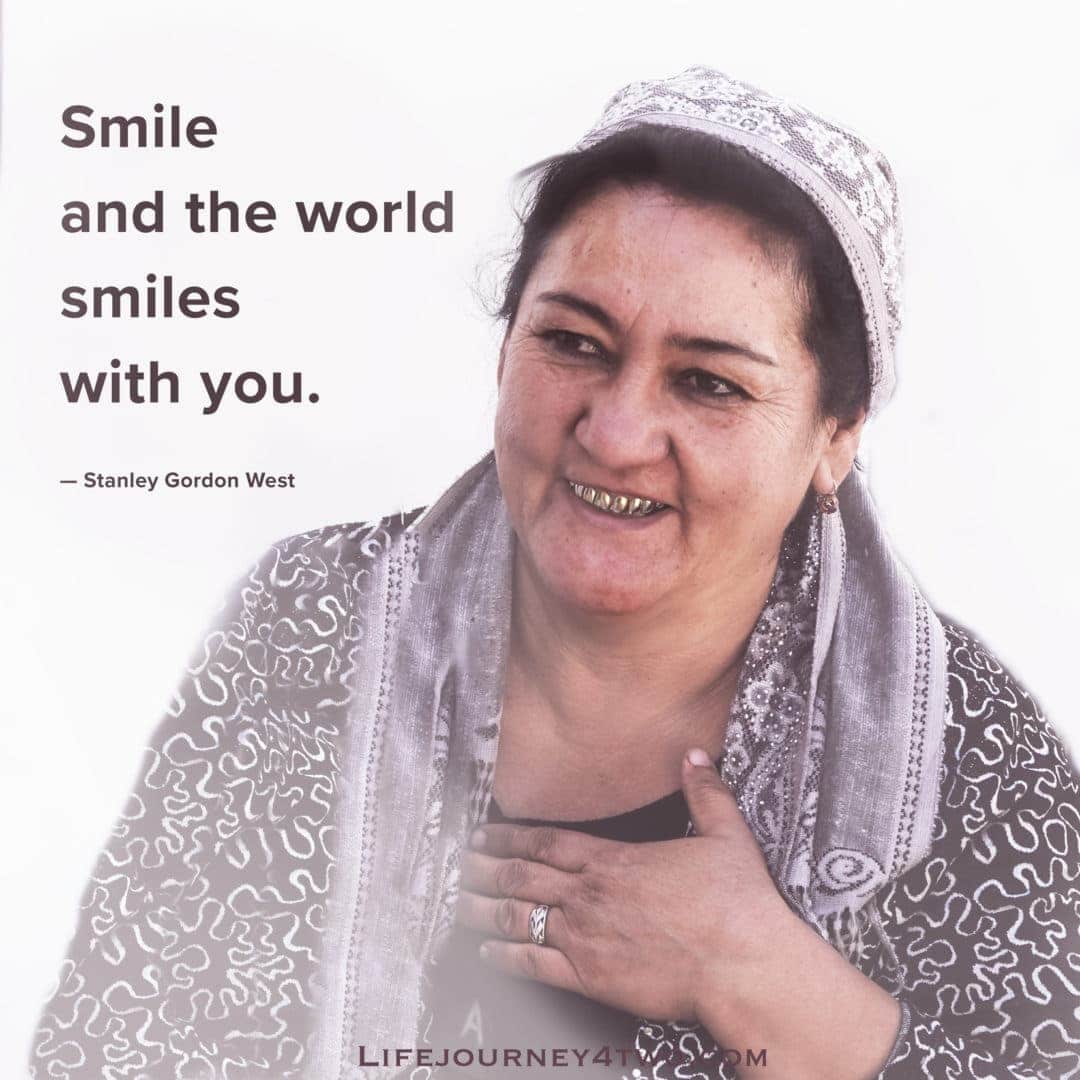 Uzbek woman smiling by the quote smile and the world smiles with you