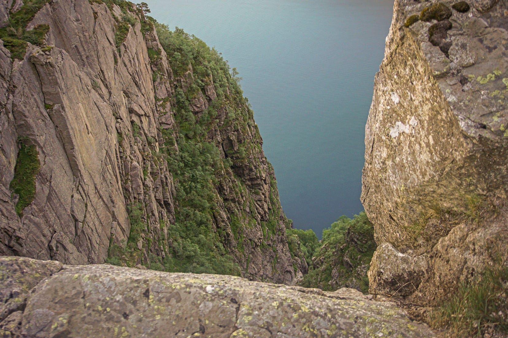 View over the edge of a cliff at a 600m drop into a fjord_Pulpit Rock