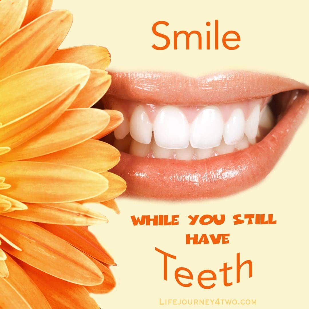 orange flower beside a pair of lips showing teeth and the smiling caption Smile while you still have teeth
