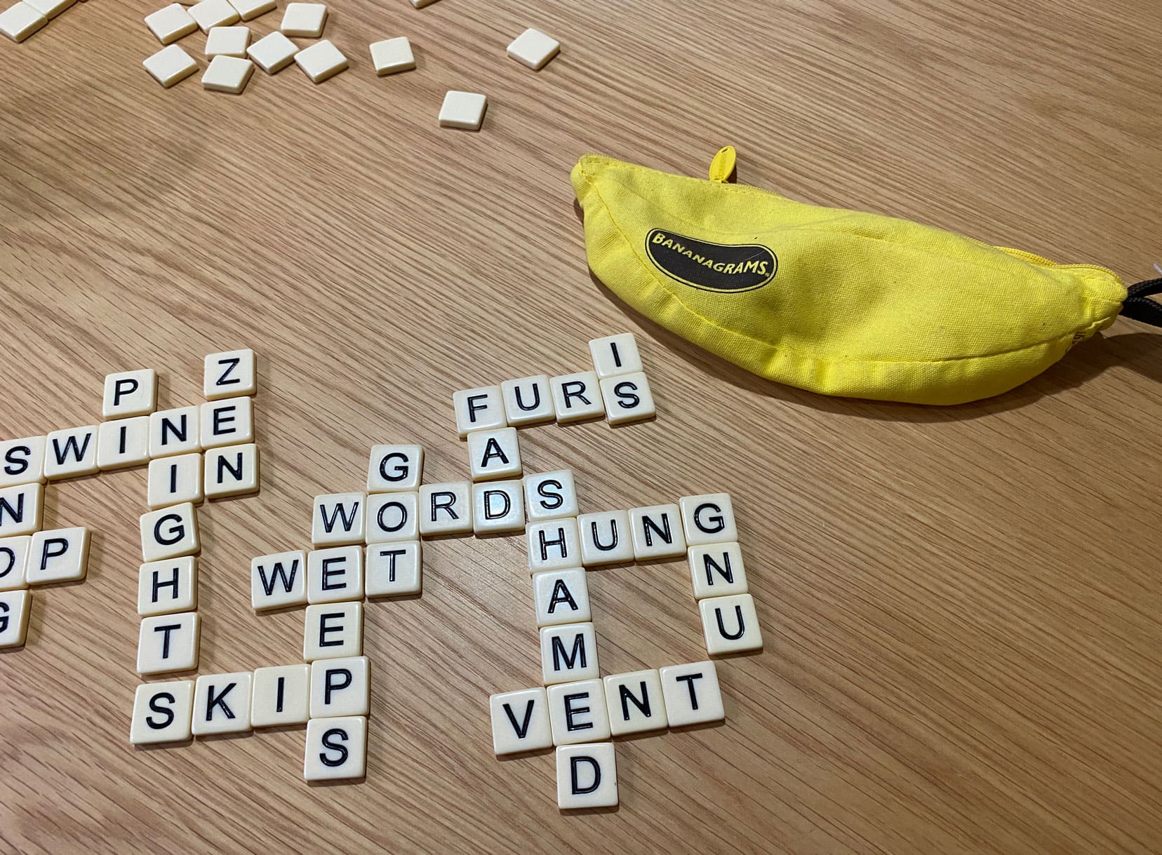 Our game of bananagrams - with letter tiles forming words linking together much like a crossword and the banana shaped cloth container
