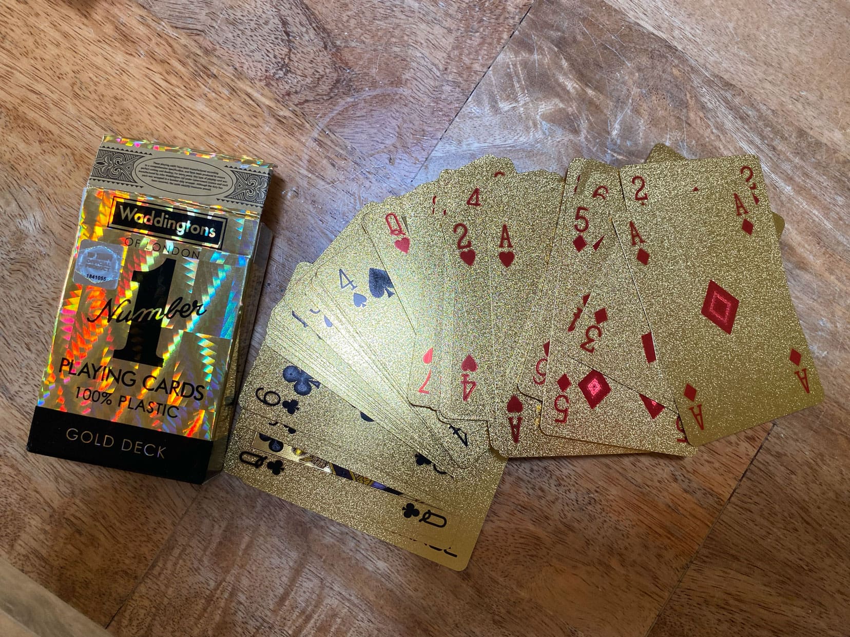 Pack of Waddingtons playing cards showing the gold cards and the box