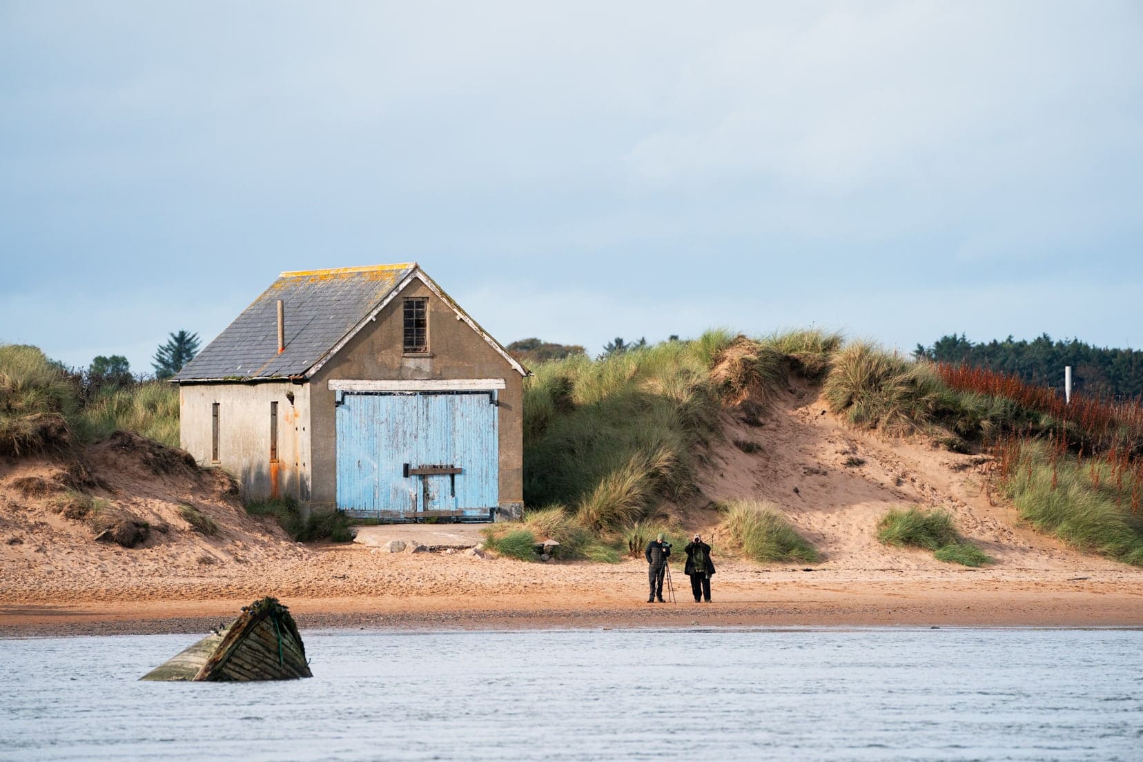 Blue doored hut on the beach beside the Ythan Estuary