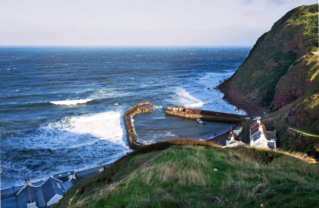 Pennan harbour seen from cliff top above