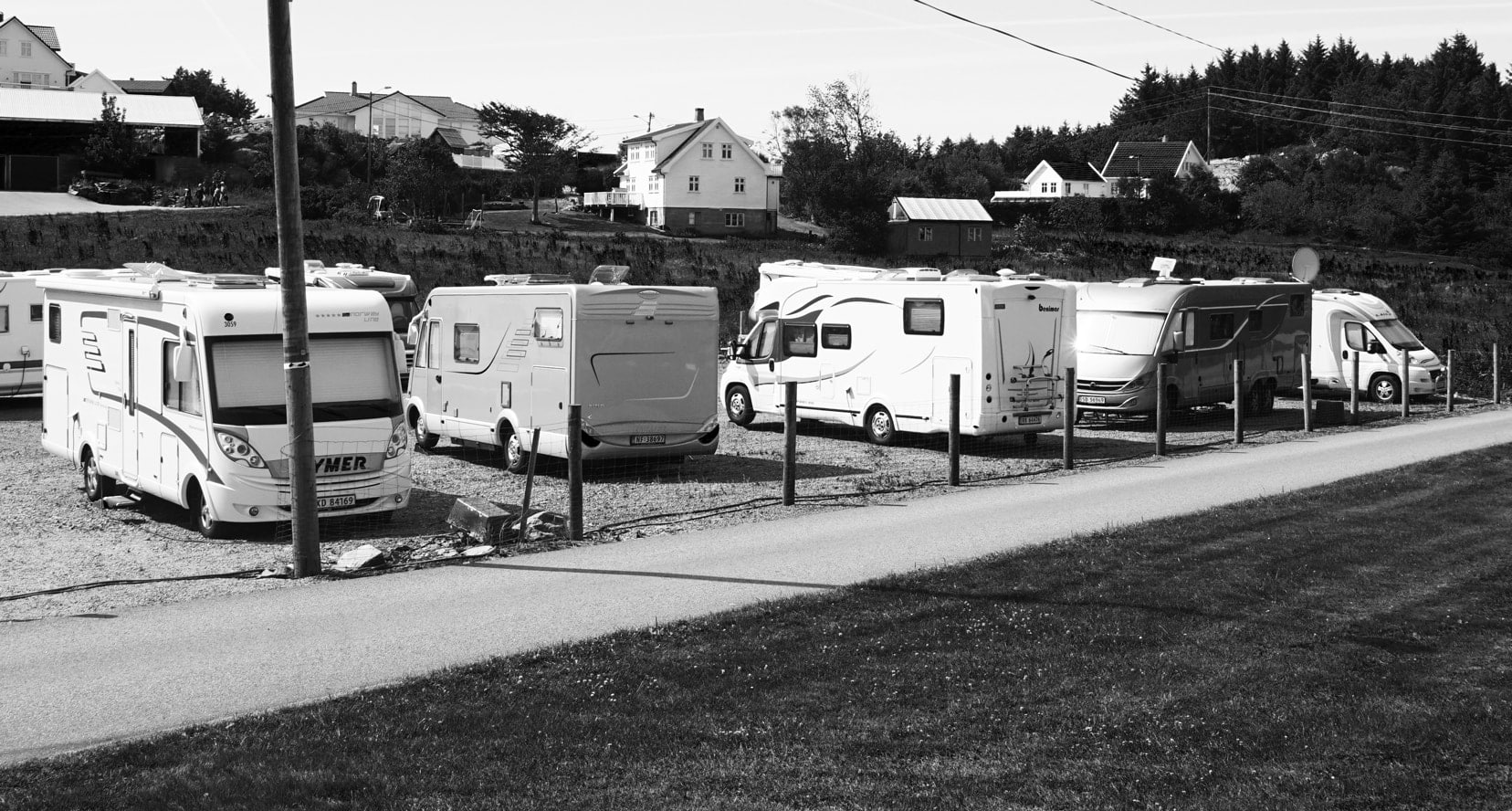 row of motorhomes at a campsite