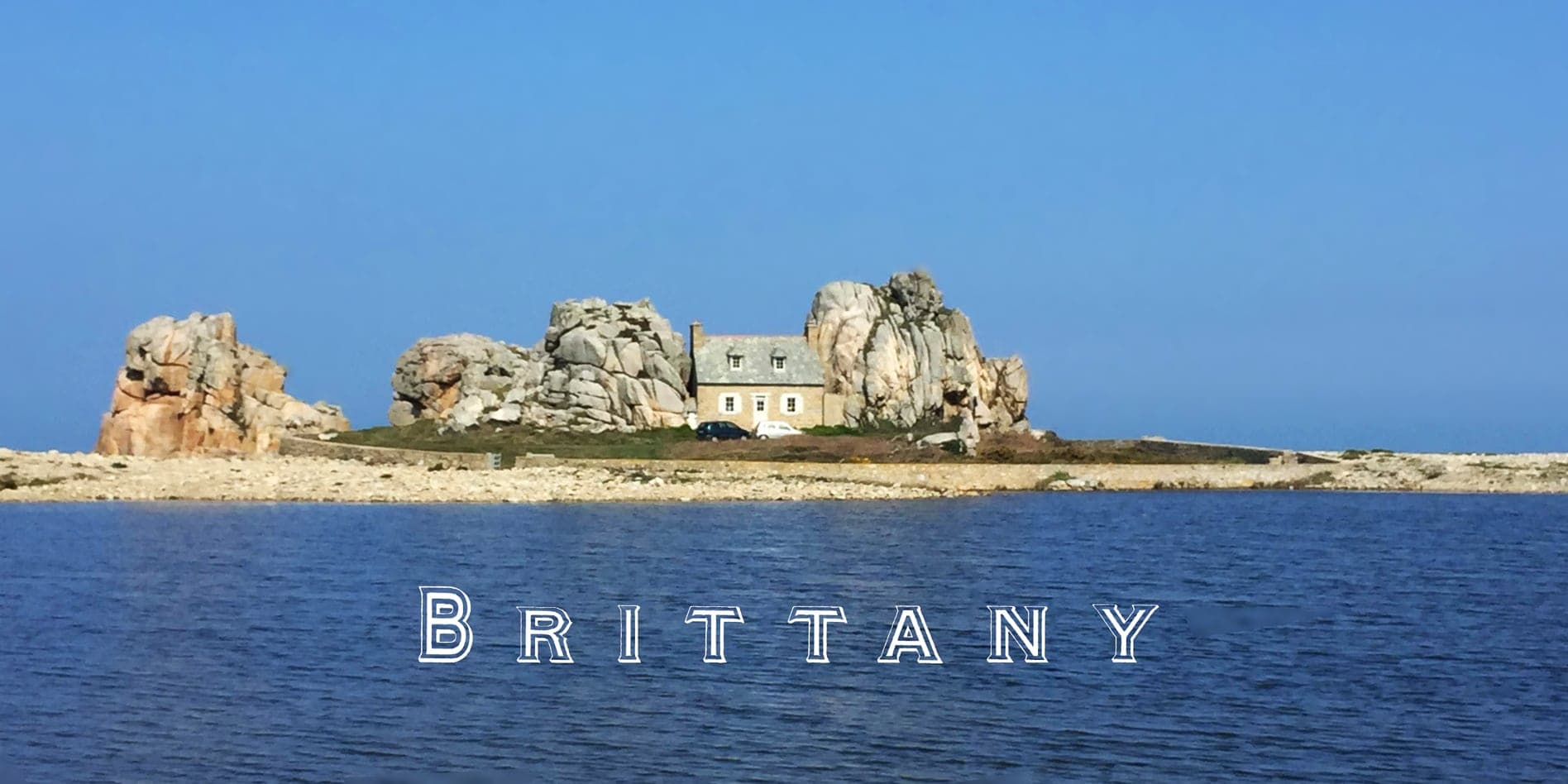 Brittany header pic with the sea and a house between rocks