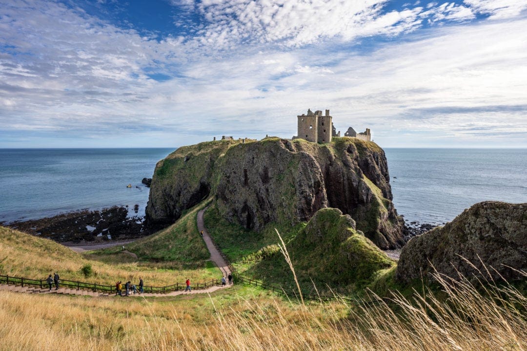 dunnotar castle ruins perched on a craggy cliff top