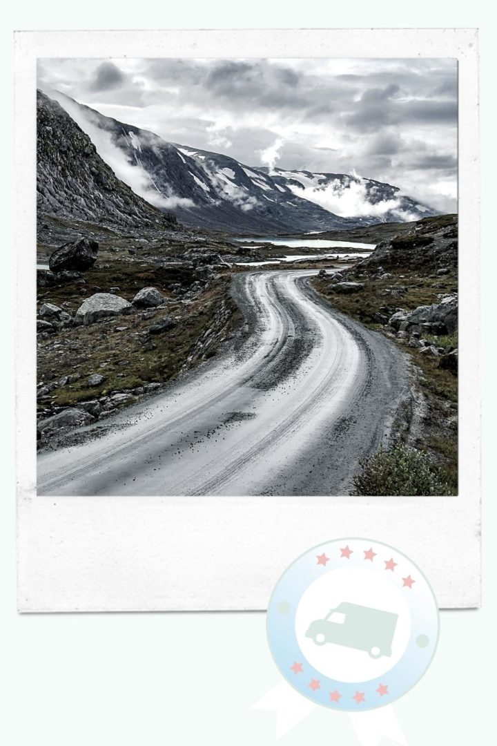 Road Tripping - windy road in snowy mountains