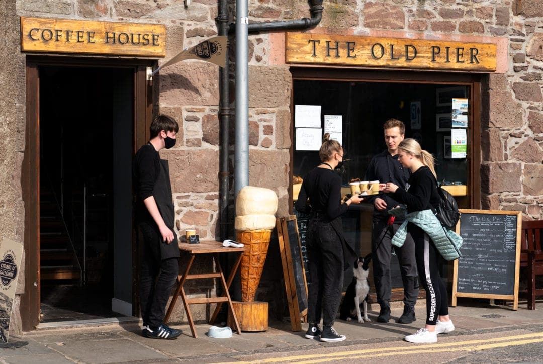 Old Pier Coffee House with a couple buying coffees outside