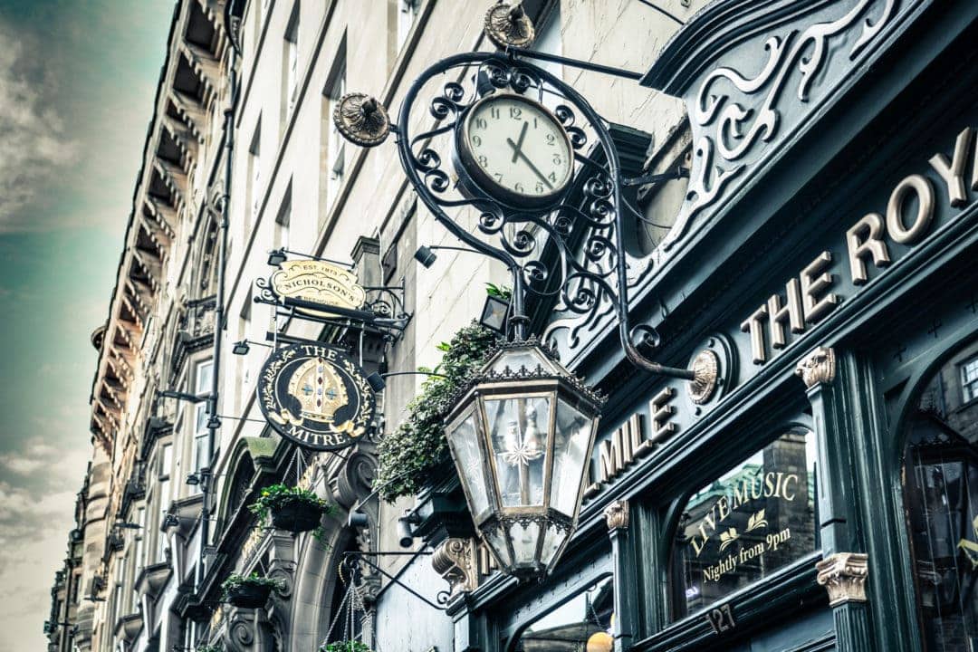 Royal-mile-building-signs and clock 