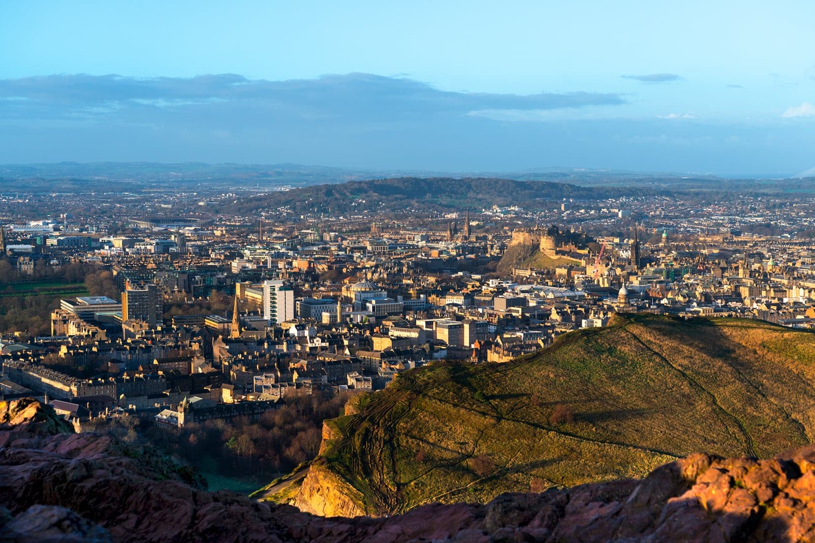 View-of-Edinburgh-from-Aurthur's Seat Summit, including Edinburgh Castle on the top of a hill