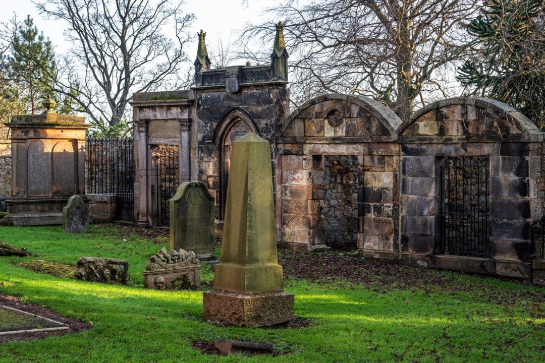 Duddingston Kirk Graveyard showing bars and railings around the tombs