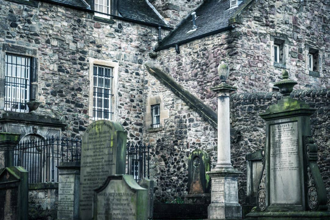 Kirkyard in old-edinburgh-town-with-gravestones