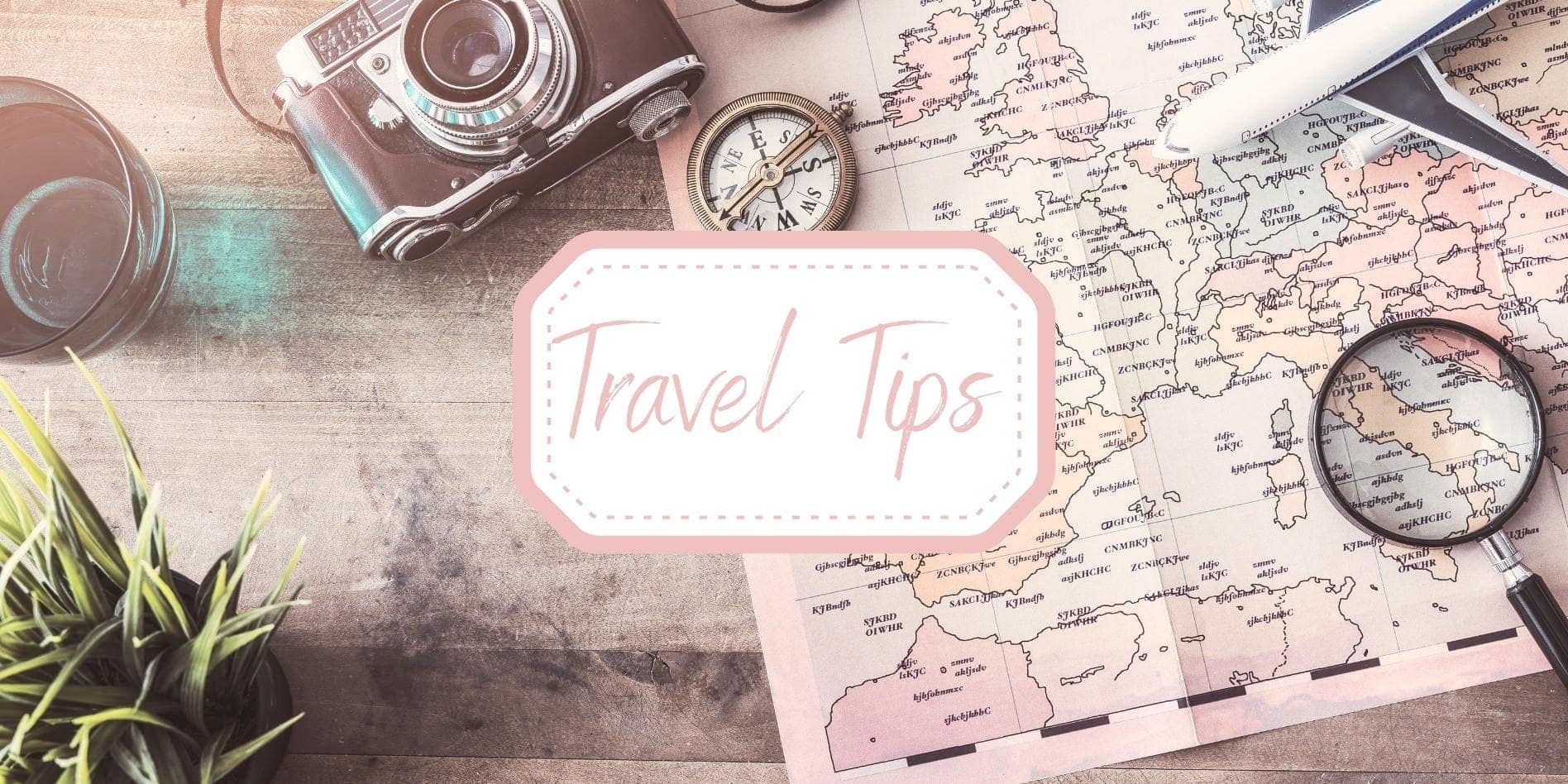 Travel-tips-header photo of map, camera, magnifying glass