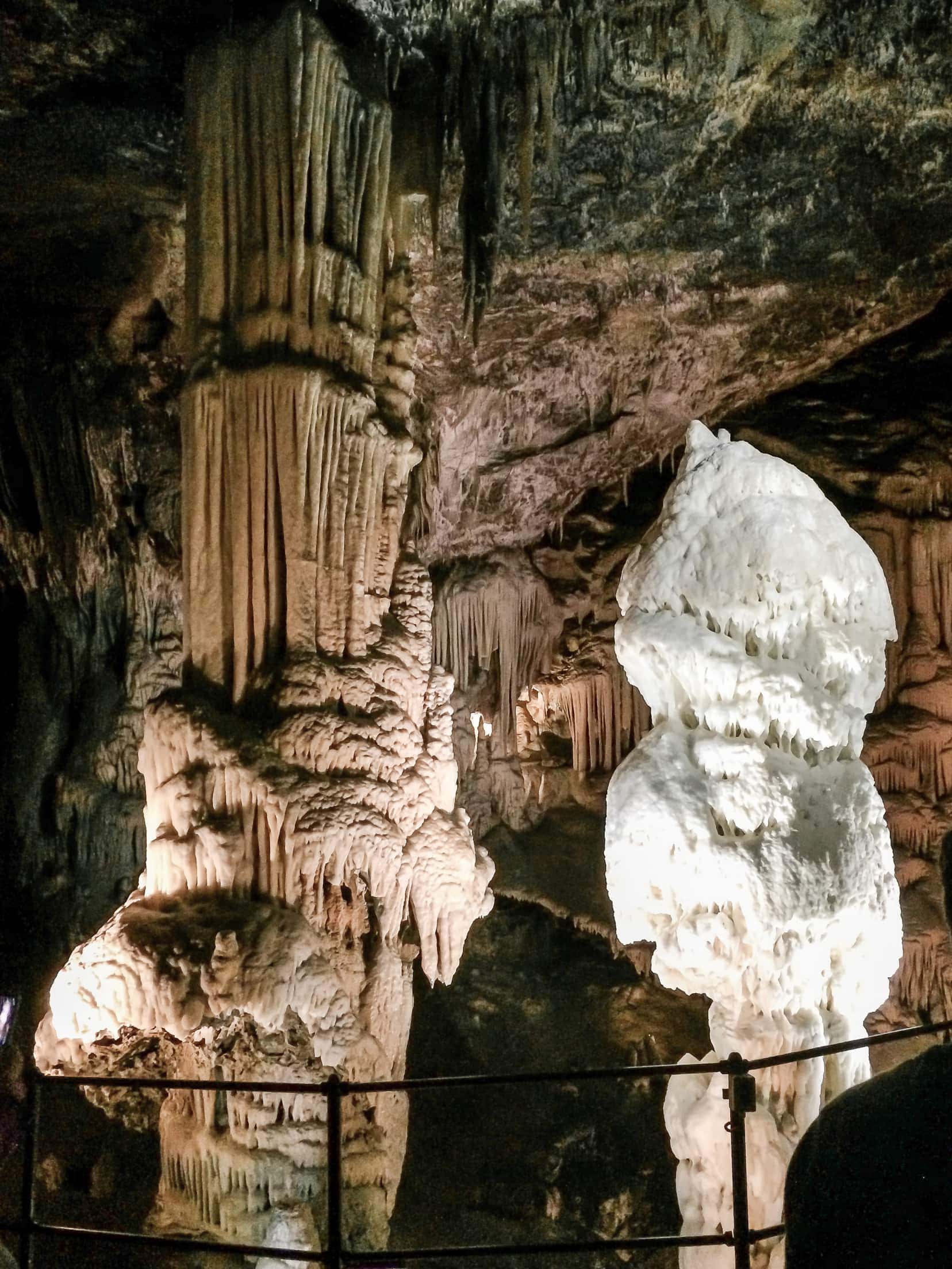 A white stalgmite called Brilliant beside the Baraque ( broenish stalagmite of individual rod like crystals