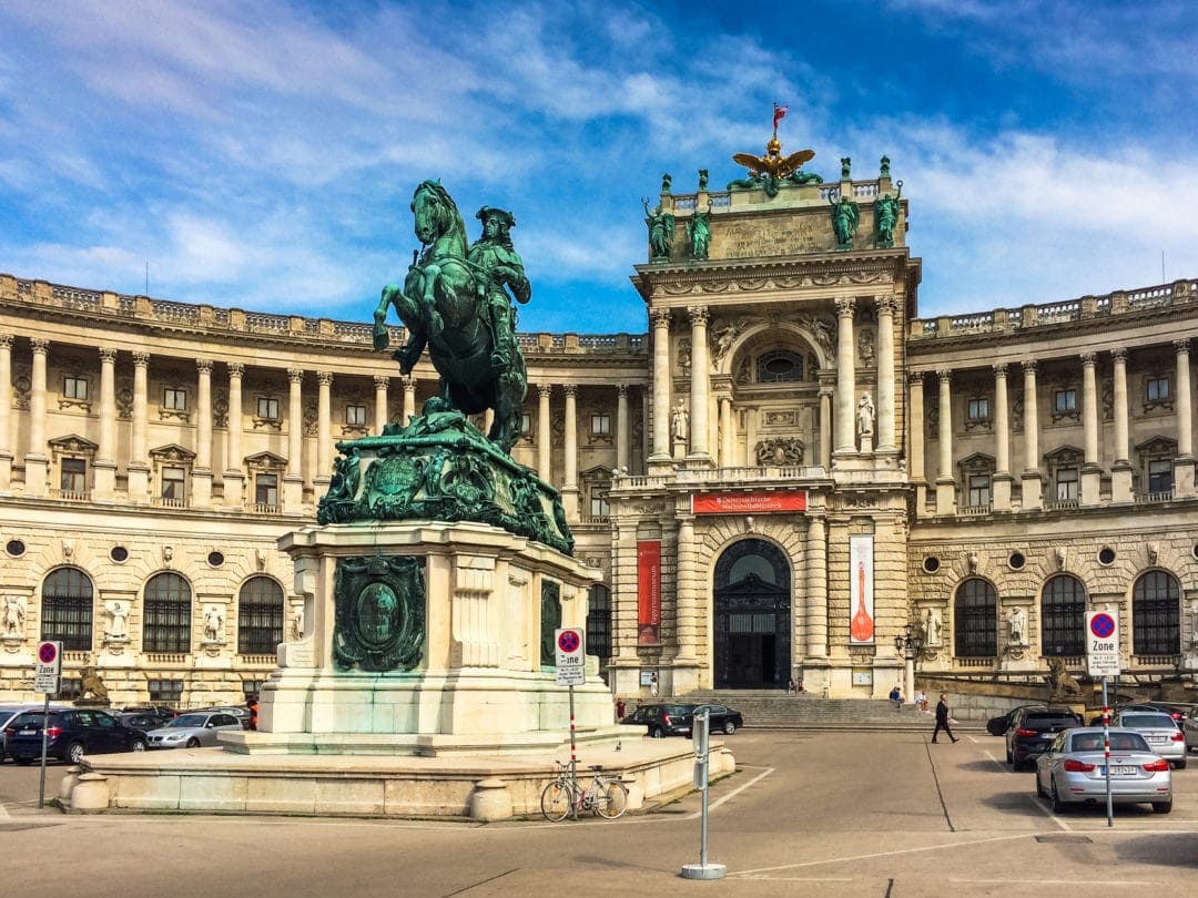 Hofburg-Palace with a green statue with man on horse