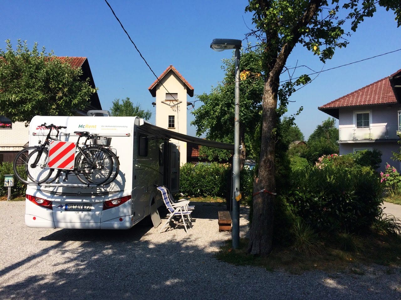 Ljubljana-Campsite motorhome parked beside a tree