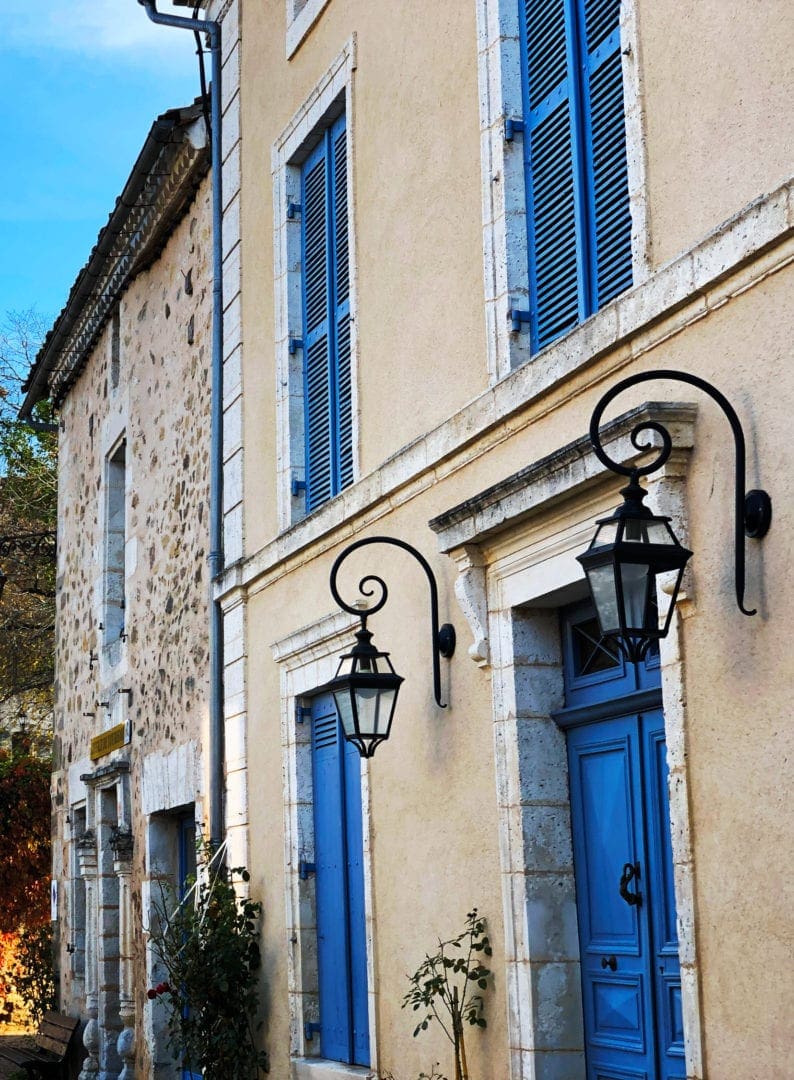 blue shutters on french village house