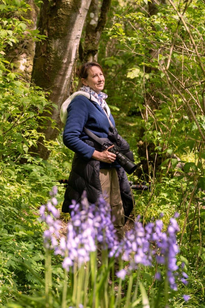 Shelley stood in Binscart wood with bluebells in the foreground