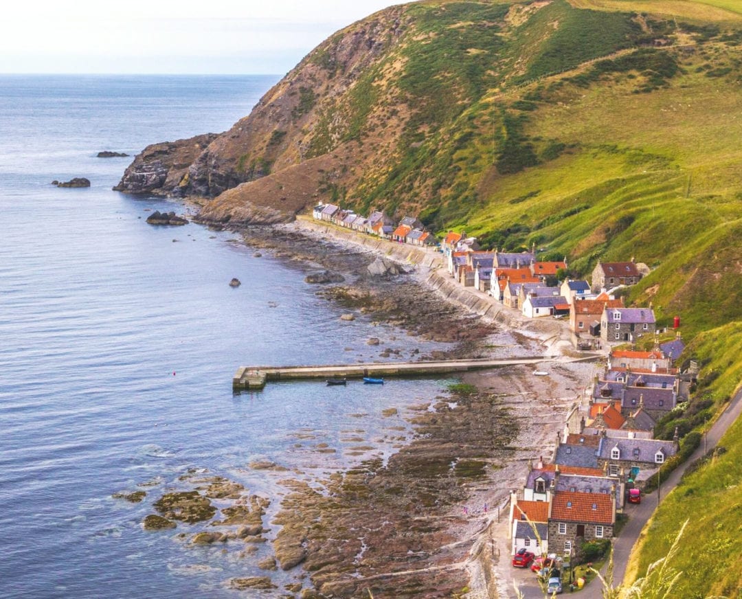 Crovie-Village aerial view  — a narrow row of house squeezed in between the seashore and the  cliffs behind