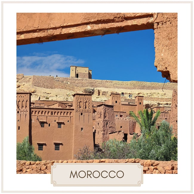 Destination Morocco image with photo of red earth buildings