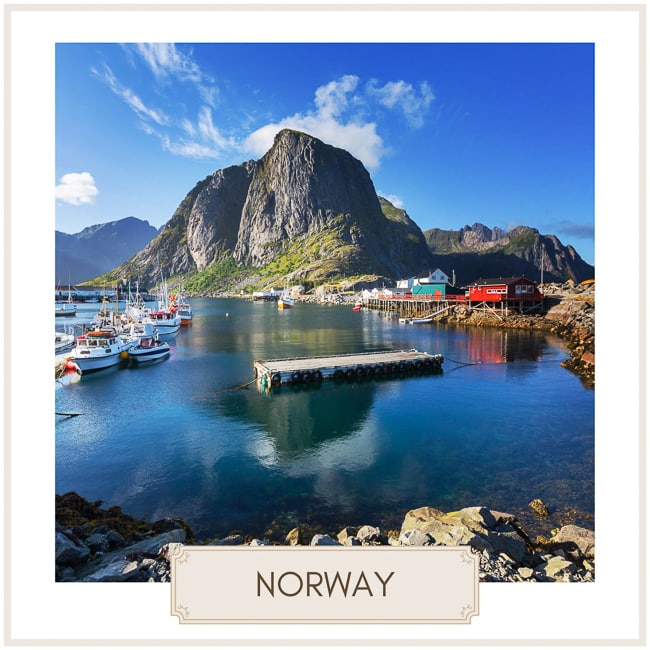 Destination Norway image of mountain with village by the water 