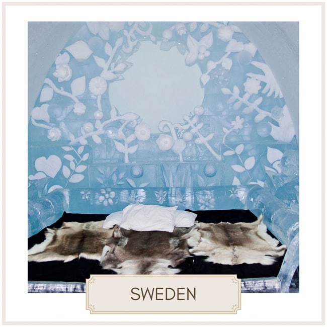 destination sweden image of the inside of an ice bedroom with reindeer blanket and ice sculpture surrounding the bed