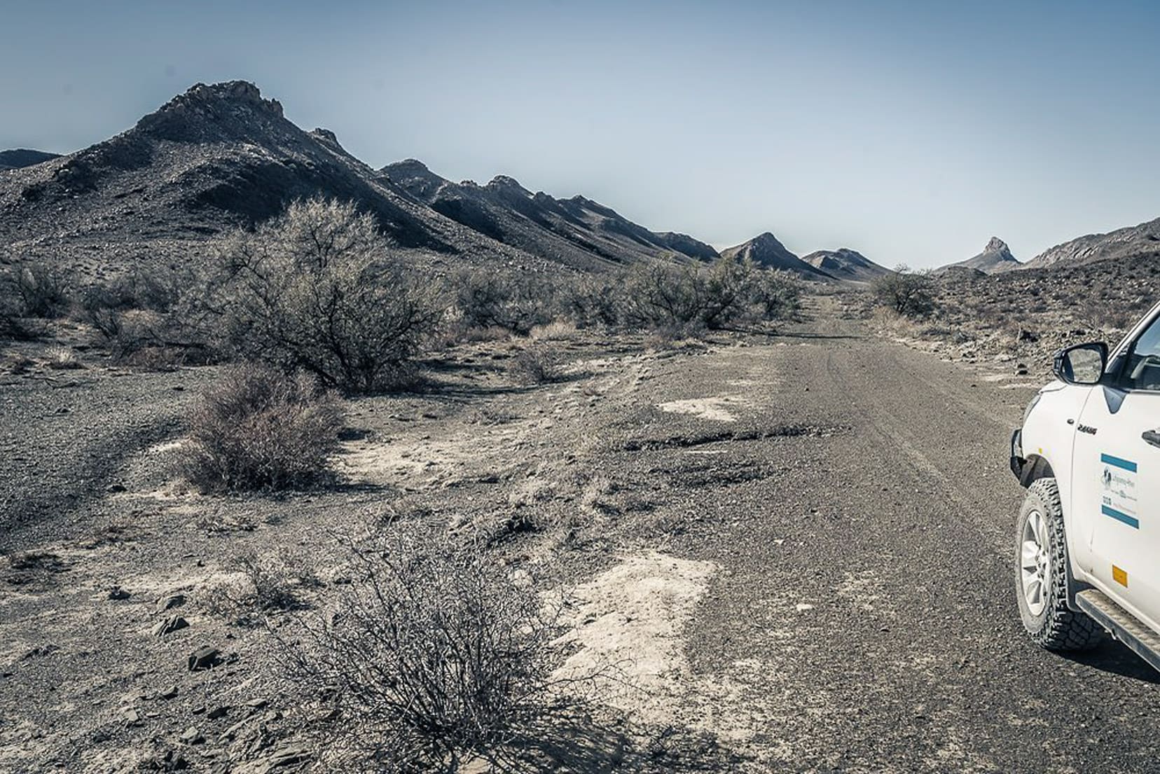 4wd in a desert with hills nearby