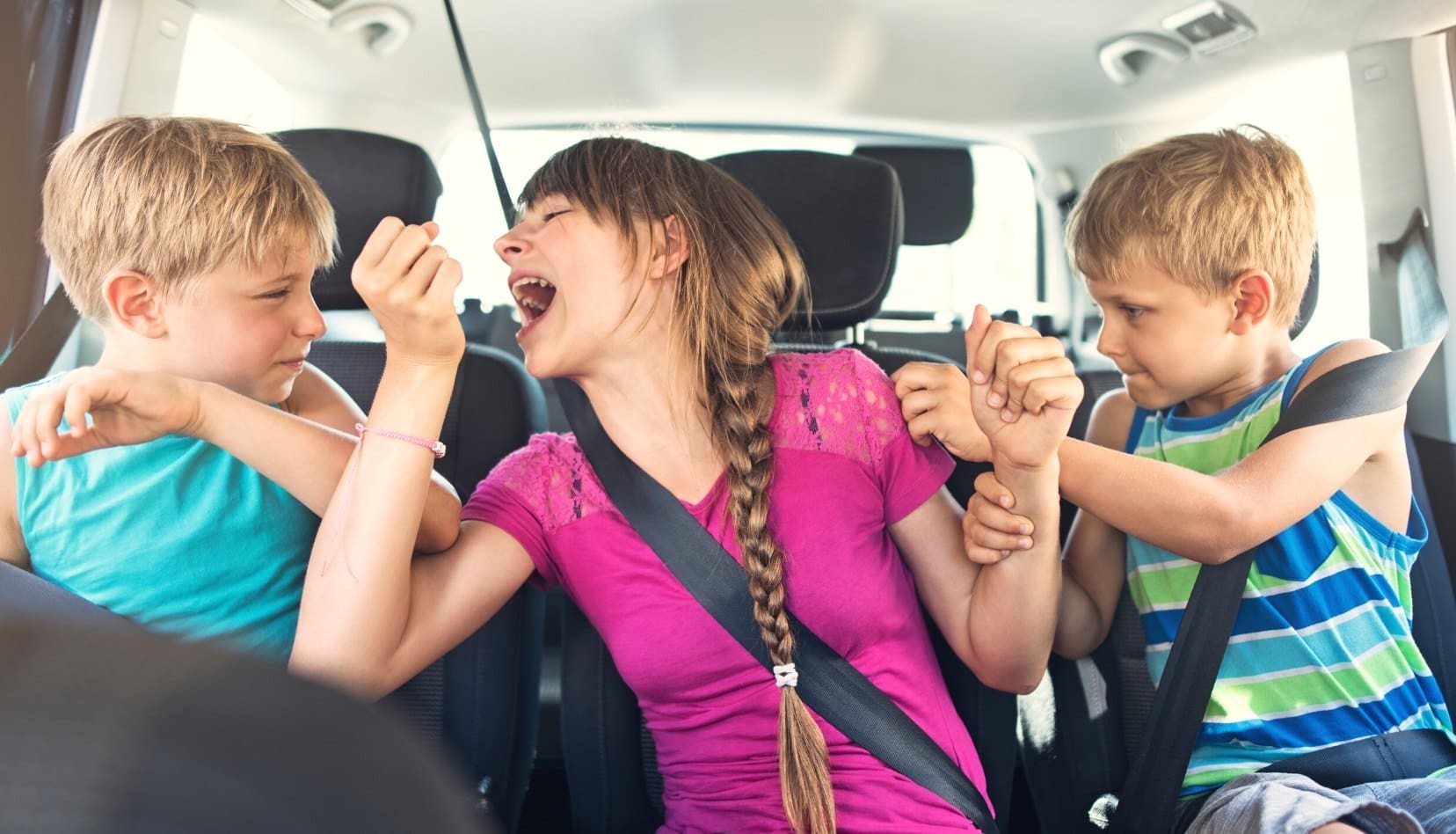 Kids fighting in back of car