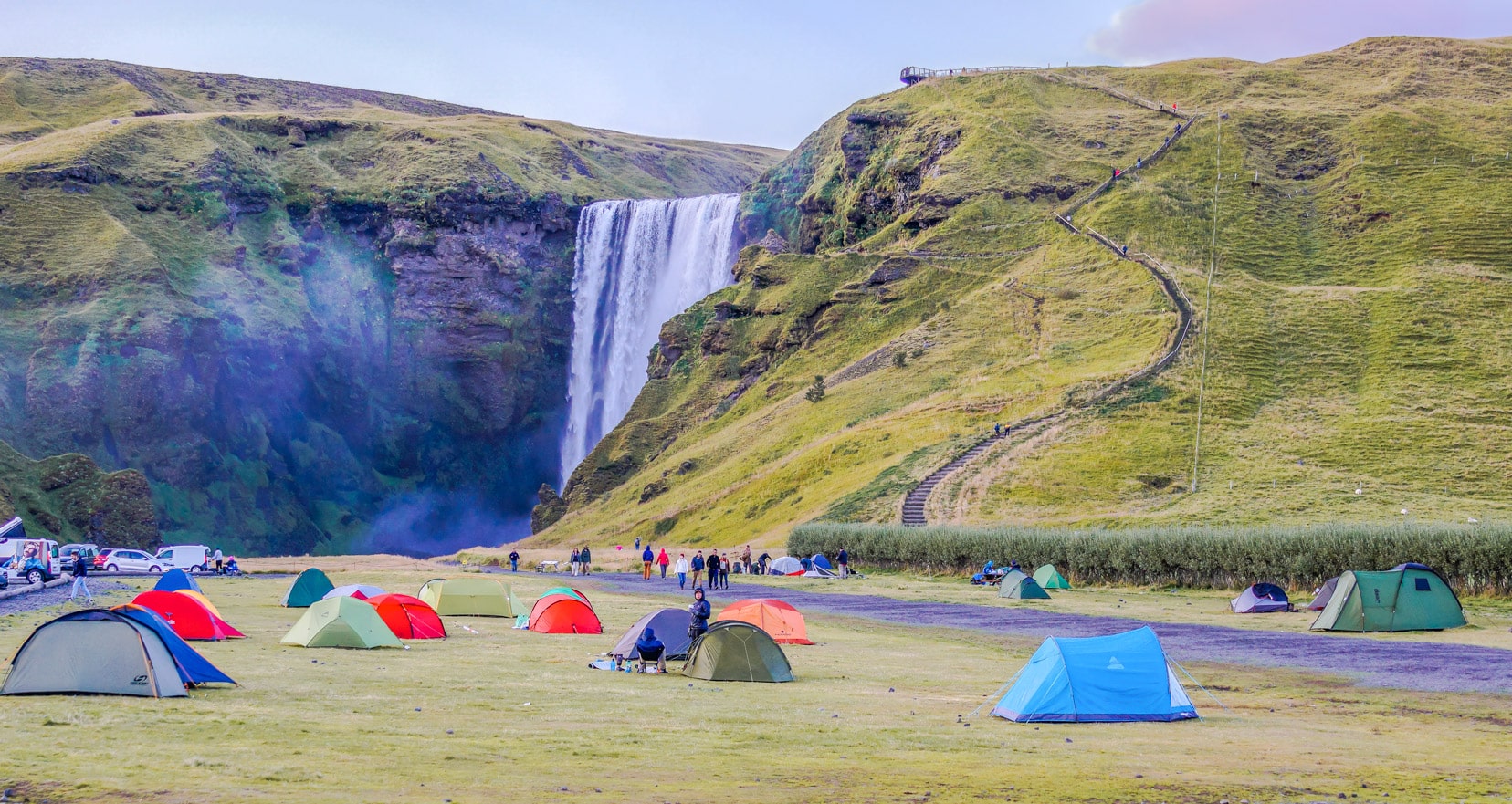 tents near a waterfall base in Iceland